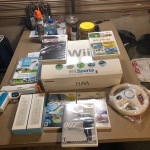 Wii gaming set with extra controls , games